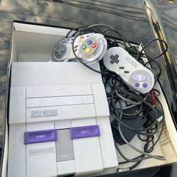 super nintendo with games