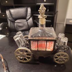 Beautiful drinking wagon decor with four shot glasses