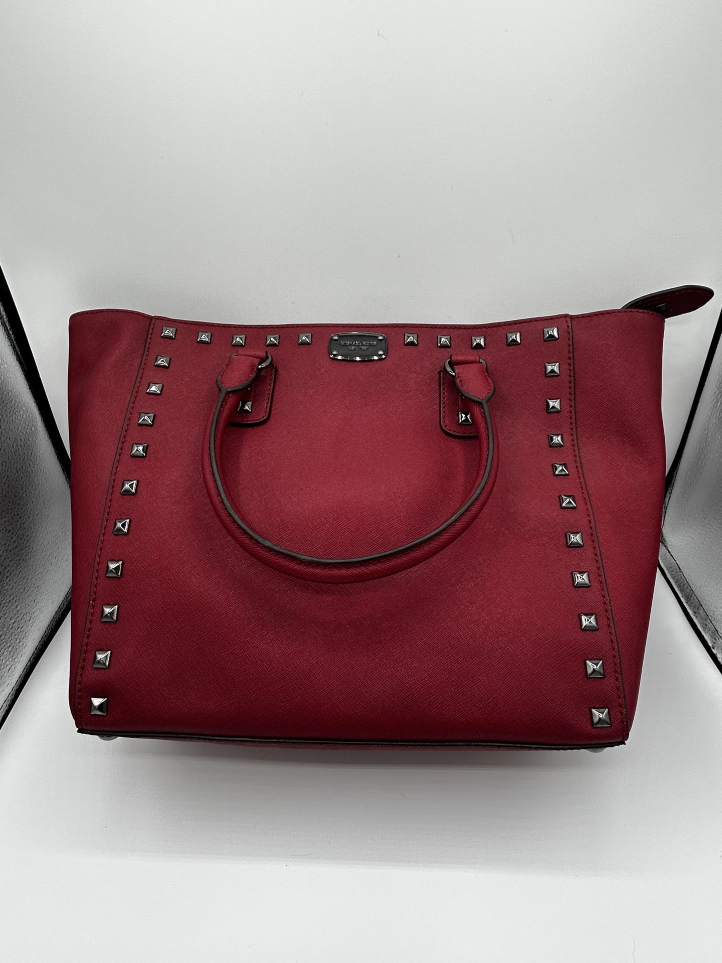 Burgundy bag with black studs Michael Kors