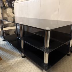 Black Glass & Chrome TV Stand – Modern & Sturdy