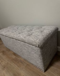 Grey ottoman storage bench
