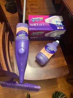 Swiffer, extra unopened wet jet wood cleaner, and unopened 24 pack of mopping pads.