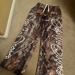 Brown and tan camo sweatpants with a relaxed fit