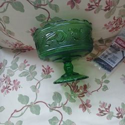 vintage E.O. Brody Co. green glass pedestal compote bowl, likely produced around the mid-20th century. Additional details include: 
It is made of pre