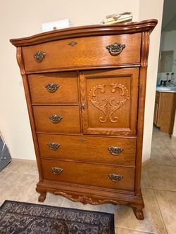 Ornate Oak Tallboy Dresser with Carved Door