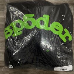 Green and black spider hoodie.