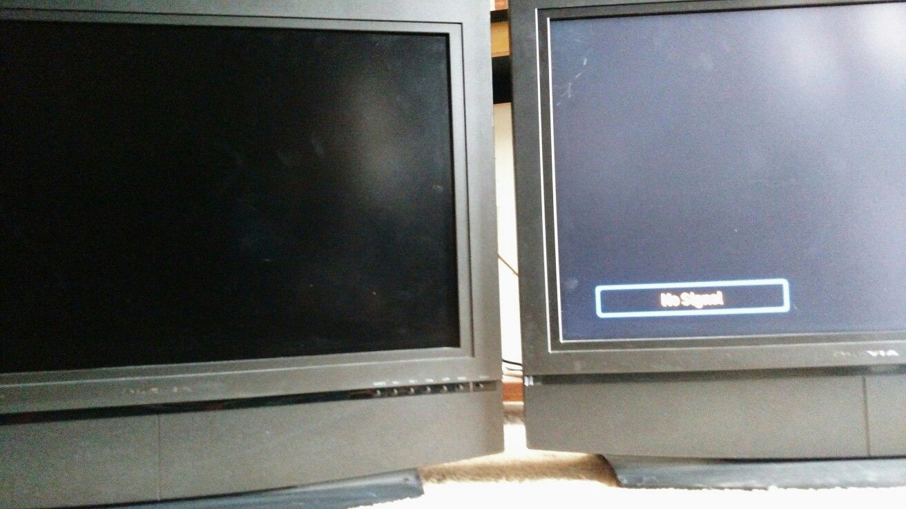 Two 32 inch olevia flat screen TVs