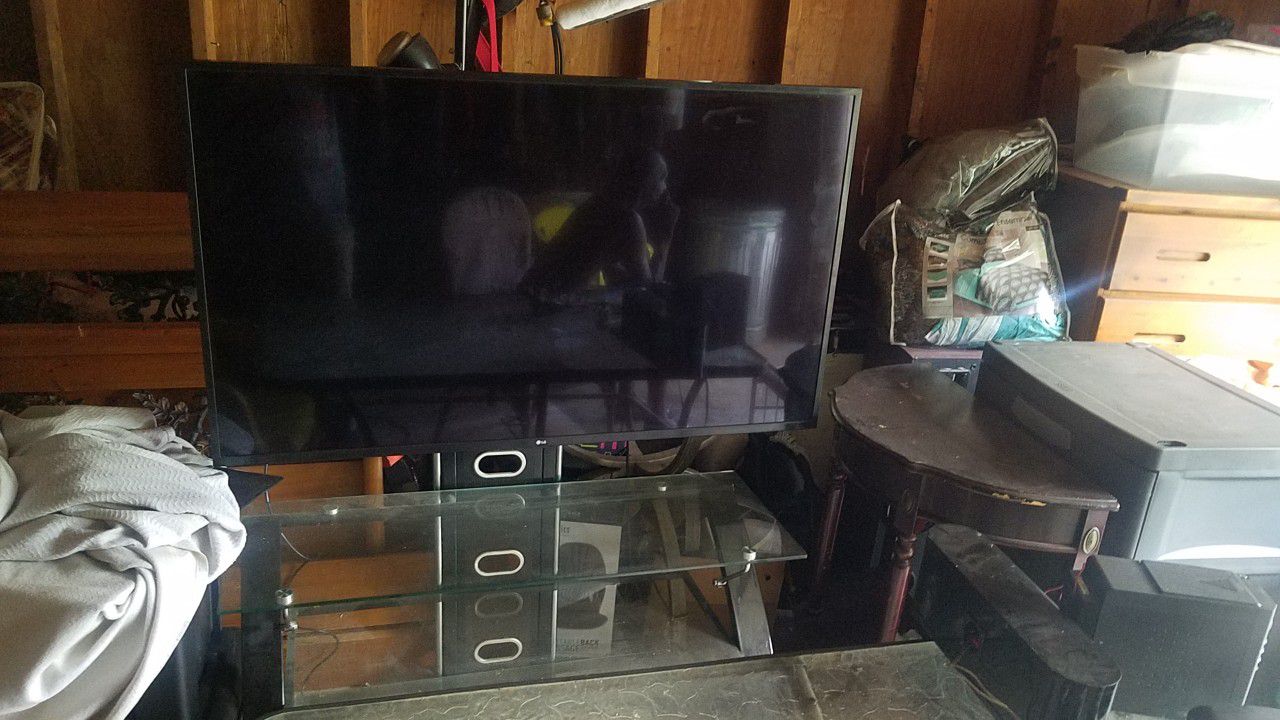 55" 4k Smart Tv LG.  With Tv Stand 
