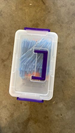 Pens and pencils and bin