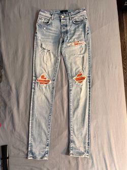 Amiri MX1 Light Wash Distressed Jeans