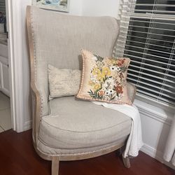 cream colored armchair