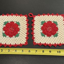Vintage hand crafted/knitted decorative pot holders. Lot of 2. Each measuring 5.25”. A few small spots shown in pictures.