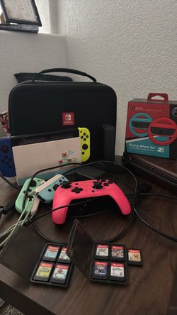 Nintendo Switch Animal Crossing Edition + 9 Games + 5 Controllers + 2 Racing Wheels + Charging Dock + Carrying Cases — COMPLETE FAMILY/GAMING BUNDLE
