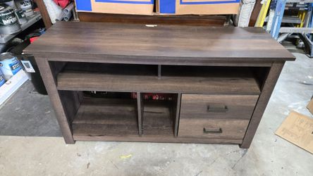 TV stand table. Has small damage at rear edge. $25