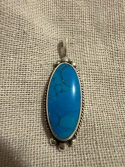 Natural turquoise native sterling silver marked pendant