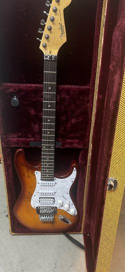 Strat style guitar, locking tremolo, comes with hard case