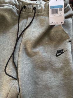 Grey Nike tech shorts with jacket
