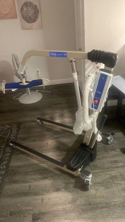 Invacare reliant Electric patient lift with 450 lb capacity and manual  low base