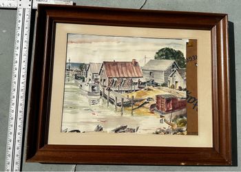 Original watercolor painting on paper with a wooden frame. This piece has a harbor scene with boats and buildings in shades of brown, blue, and green.