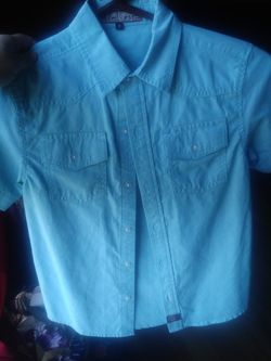 A boys collard light blue shirt 👕