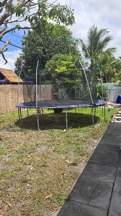 Large Trampoline With Net And Water Hose