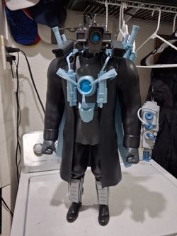 titan Cameraman action figure, from the Skibidi Toilet series. 24 inches tall. Good condition.  Collectible toy.