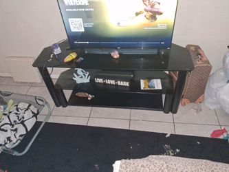 Black frame glass top TV stand