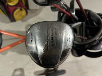 Two sets of golf clubs and golf caddy