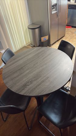 Table - good condition- 4 chairs