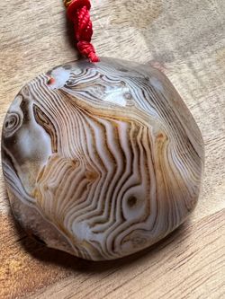 Top-quality polished banded agate crystal: 55g healing agate stone.