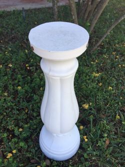 White plastic weighted pedestal