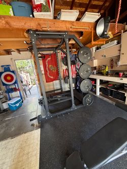 Squat rack with bars and bench plates included