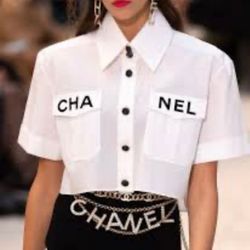 New iconic Chanel White Cotton Logo Cropped Shirt from the Spring/Summer 2019 Runway Collection, which was famously one of the final collections overs