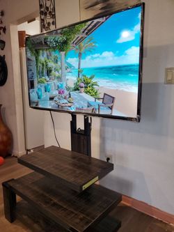 50" roku smart tv 4k basically new come with free nice  tv stand shelves . Great quality pic no scratch.  I can deliver with some fee.  Cash only