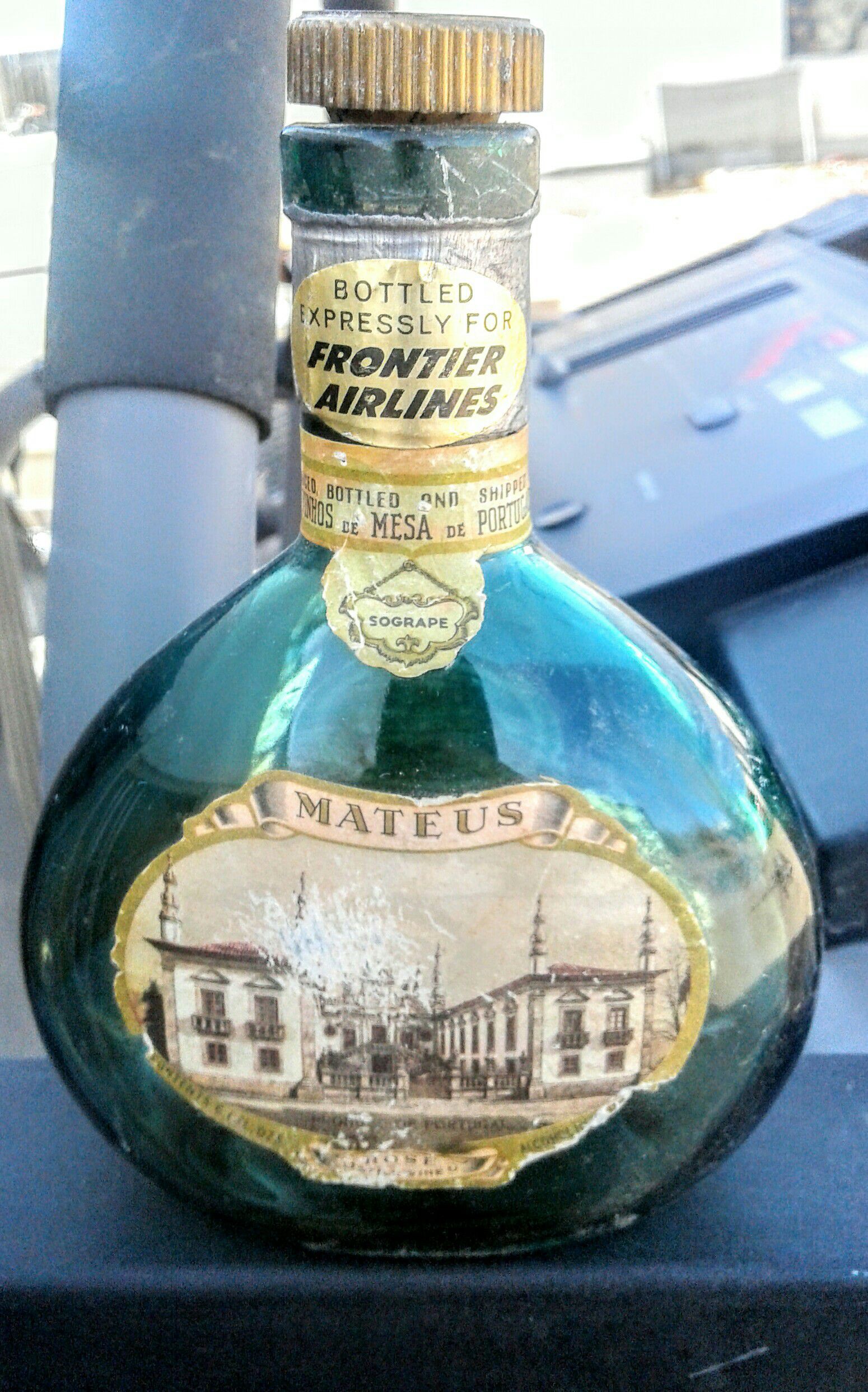Antique Frontier Airlines wine bottle