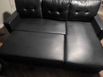 Black leather sectional couch
