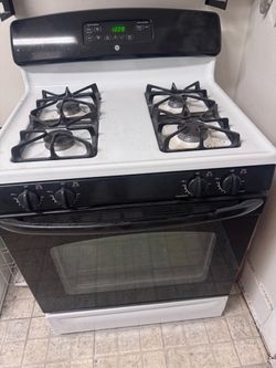 GE 4-Burner Gas Stove & Oven — $100