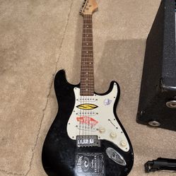 Squier Stratocaster Electric Guitar and Peavy Bandit 112 Amp