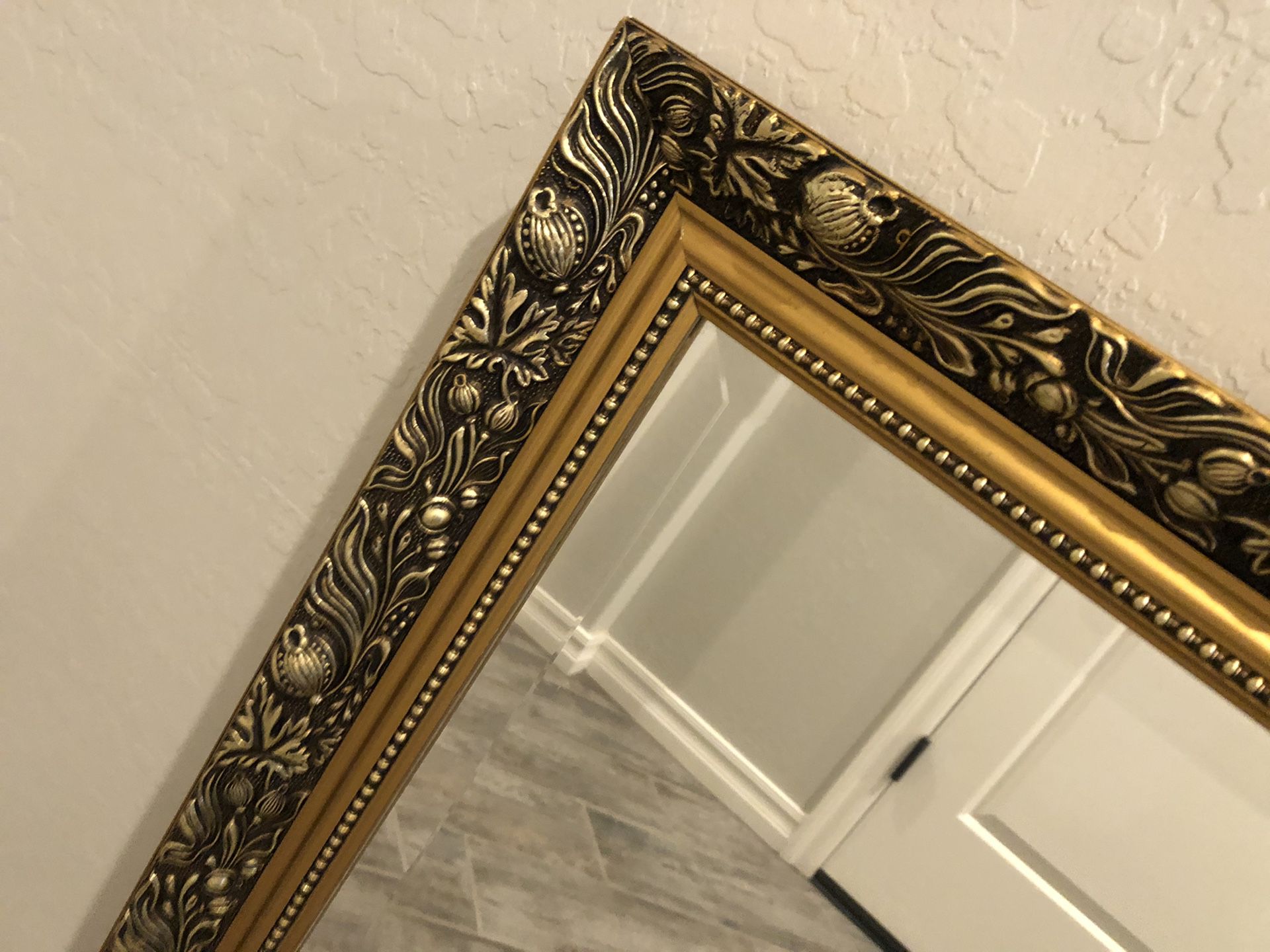 Beautiful wall hanging mirror with gold frame
