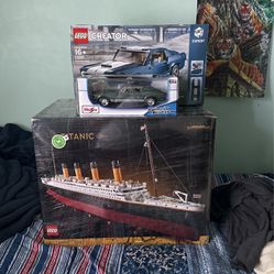 Titanic Lego, Mustang Lego(opened), and a Maisto 1967 Mustang 