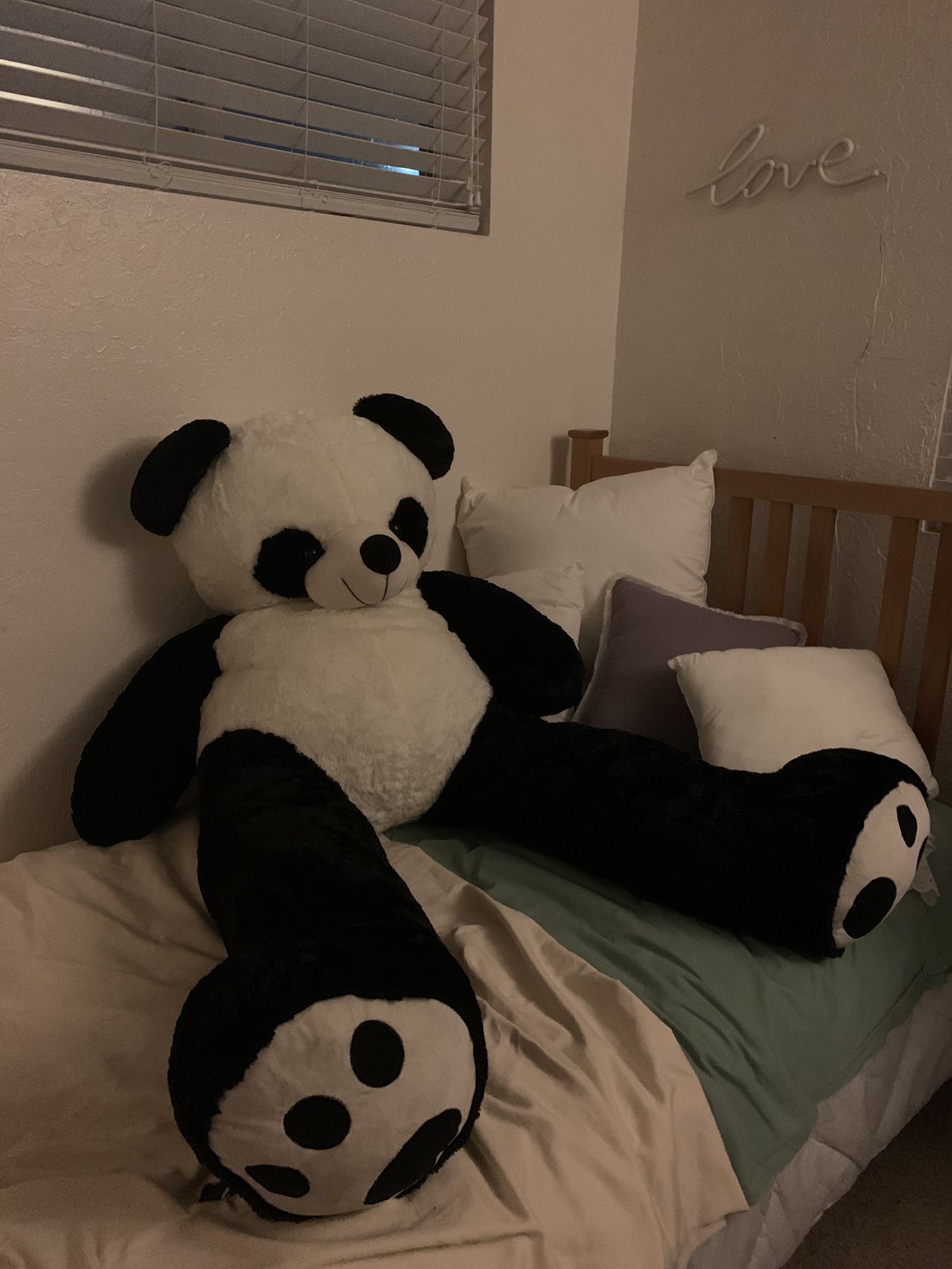 large stuffed panda bear