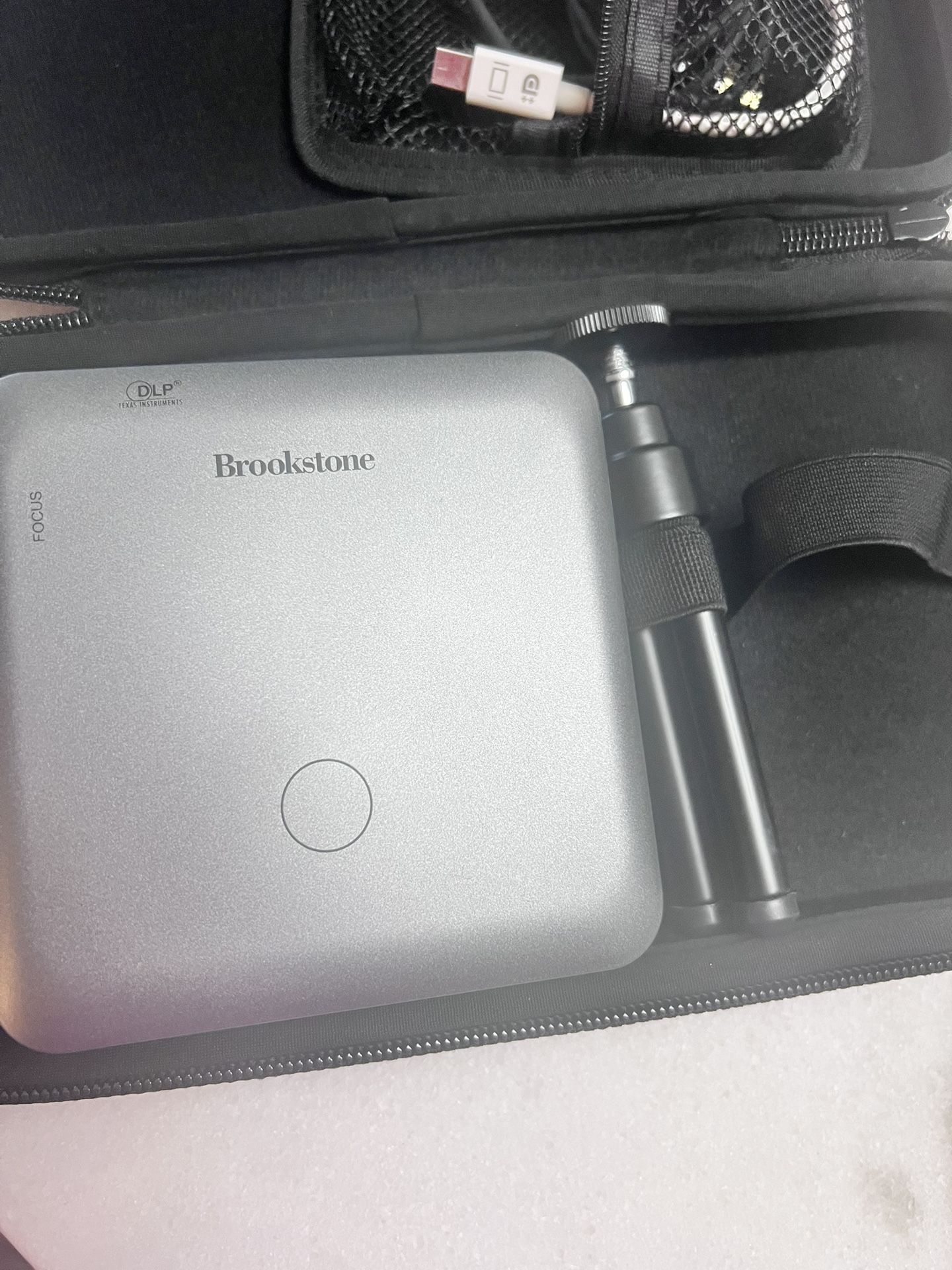 Brookstone Mini Projector And Speaker