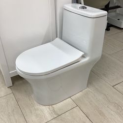 One piece toilet new in the box white color with Softclose seat tornado flush system dual flush fully skirted ready for pick up today