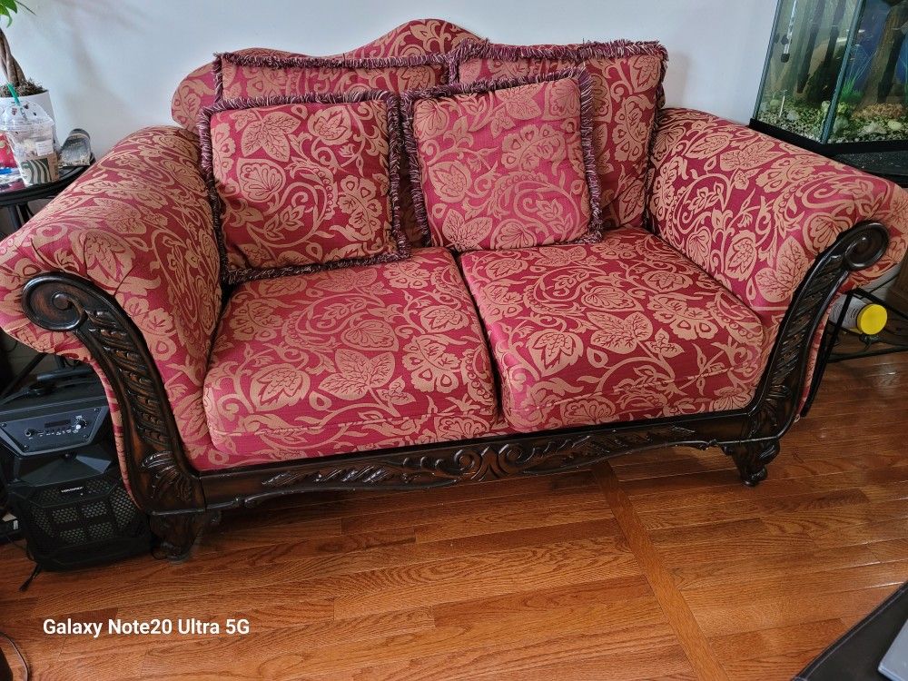 Red Patterned Loveseat And Sofa