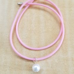 Coultured Pearl On A Rubber Cord.