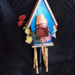 Silly Red Cardinal In a Blue Windchime House