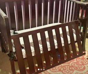 Dark cherry wood crib no mattress