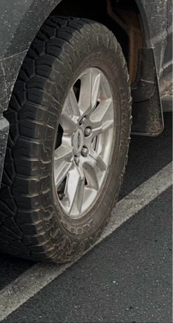 Ford OEM chrome rims with tires. 275/65/18