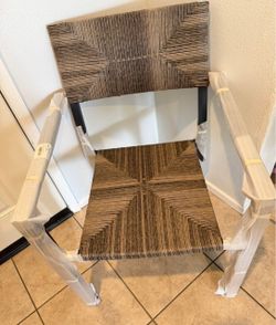 Indoor/outdoor modern metal chair with woven accent.