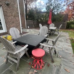 Teak outdoor set and Hampton bay propane Firepit (can be sold Sep) Table and 4 chairs from Jensen Leisure Umbrella stand and umbrella Blue and white s